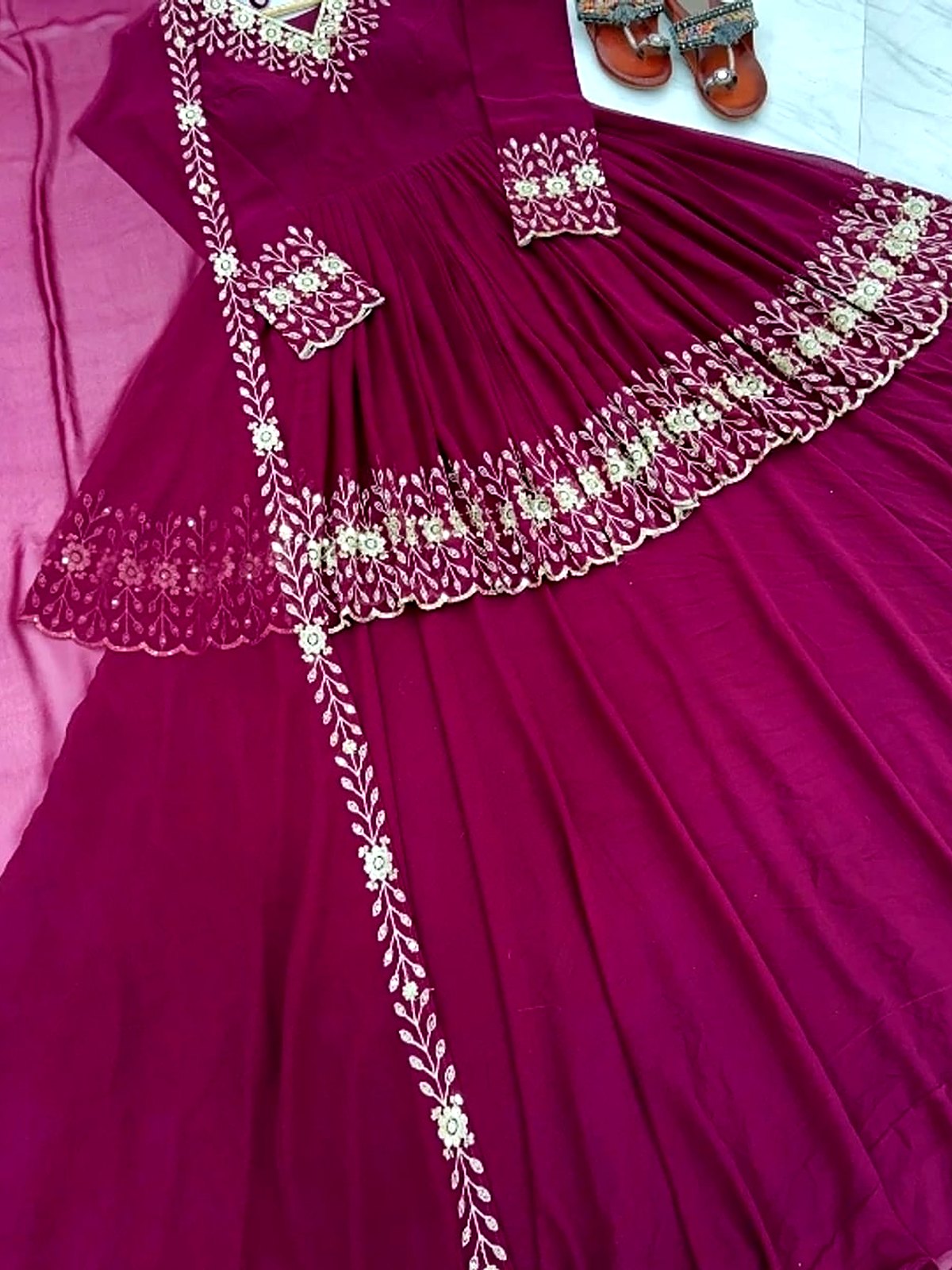 Magenta anarkali maxi with an embroidered border, laid flat