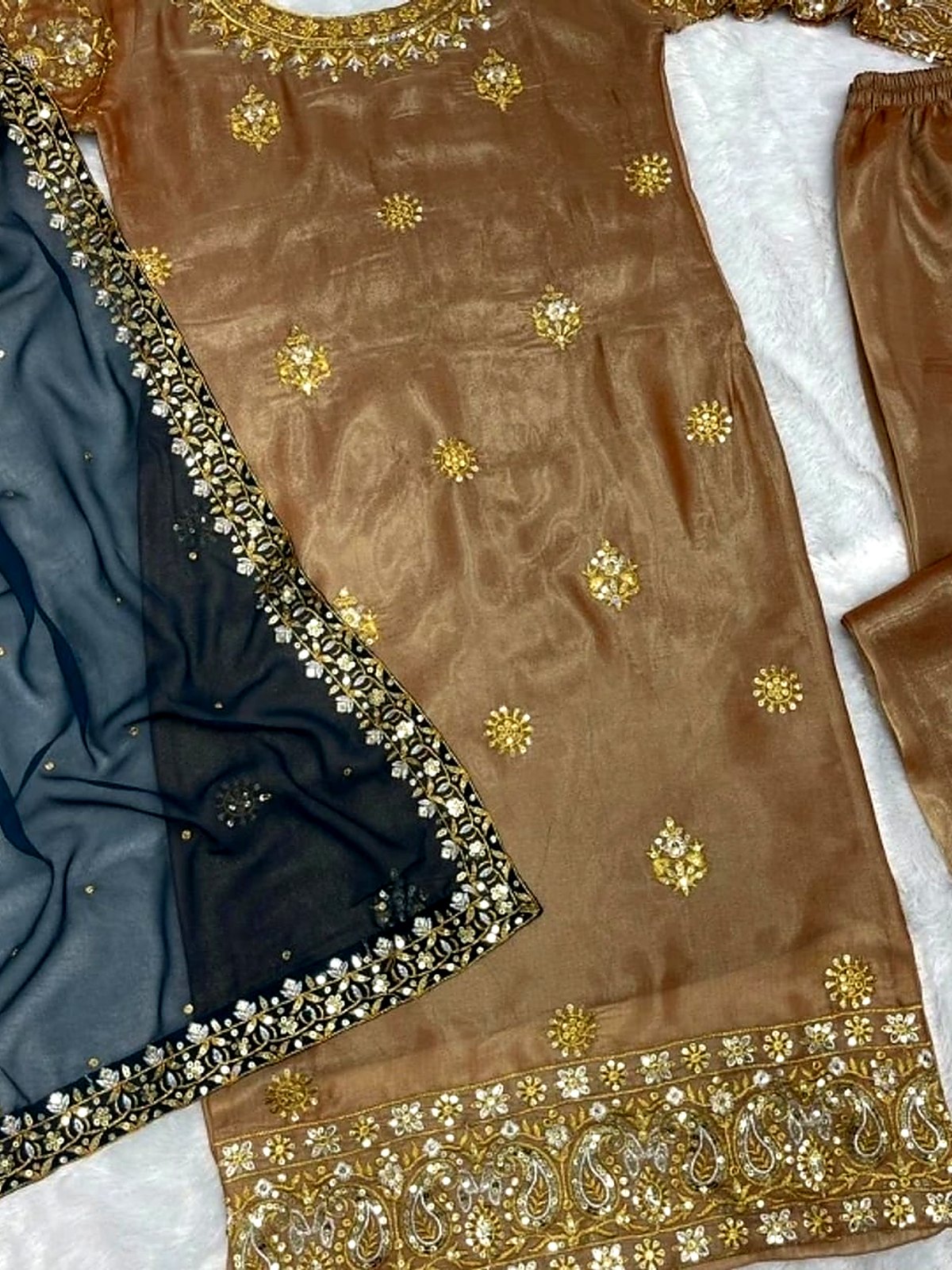 Antique gold tissue kurta with a teal dupatta, laid flat