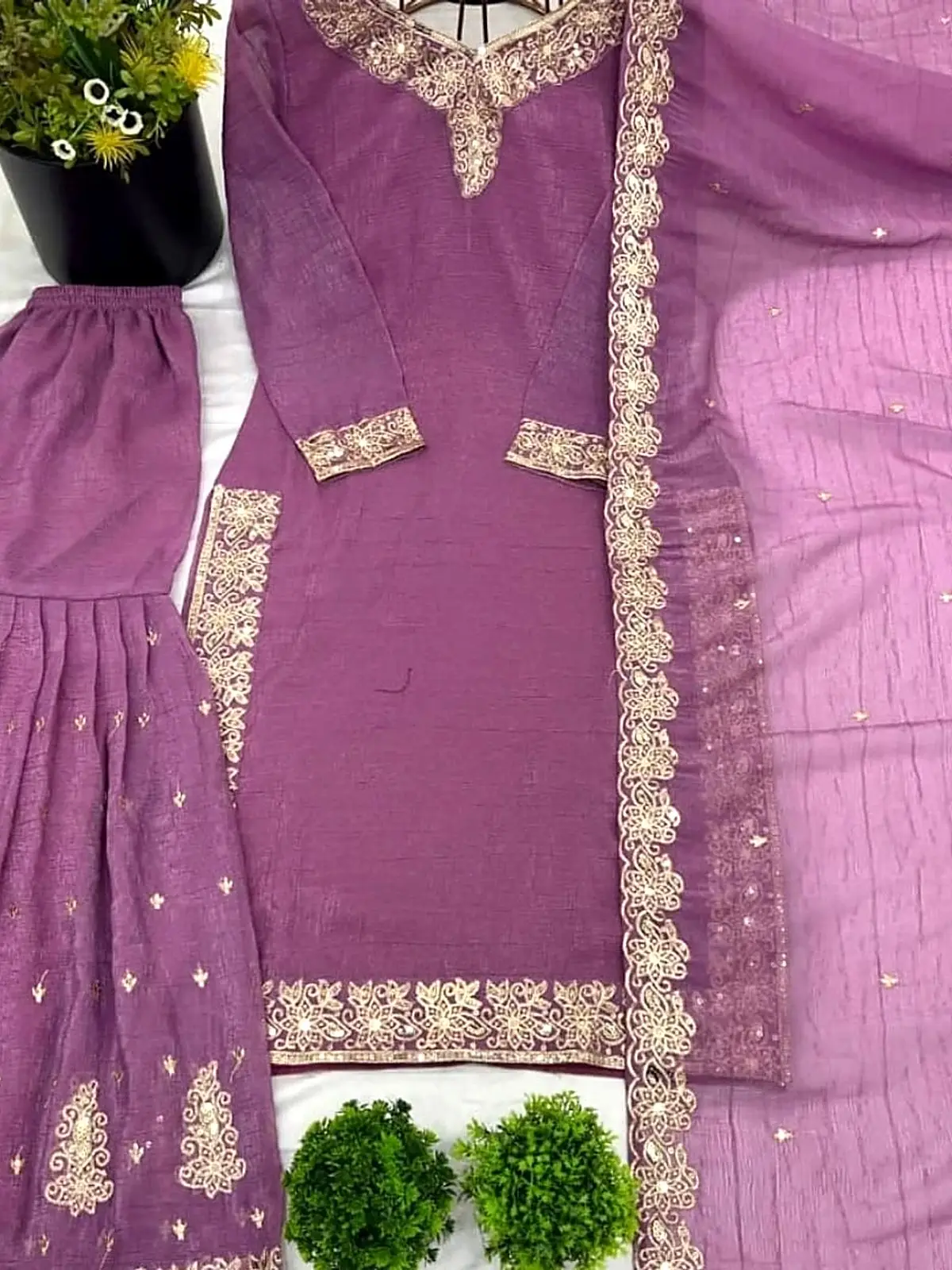 Lilac kurta with gold embroidered neckline, sharara and dupatta, laid flat