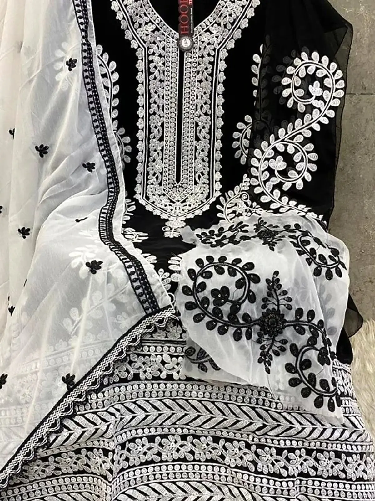 Black kurta with white chikankari embroidery and sheer embroidered dupatta