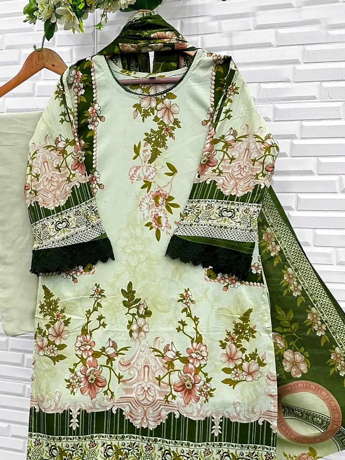 Pale green floral print kurta with olive dupatta on a hanger
