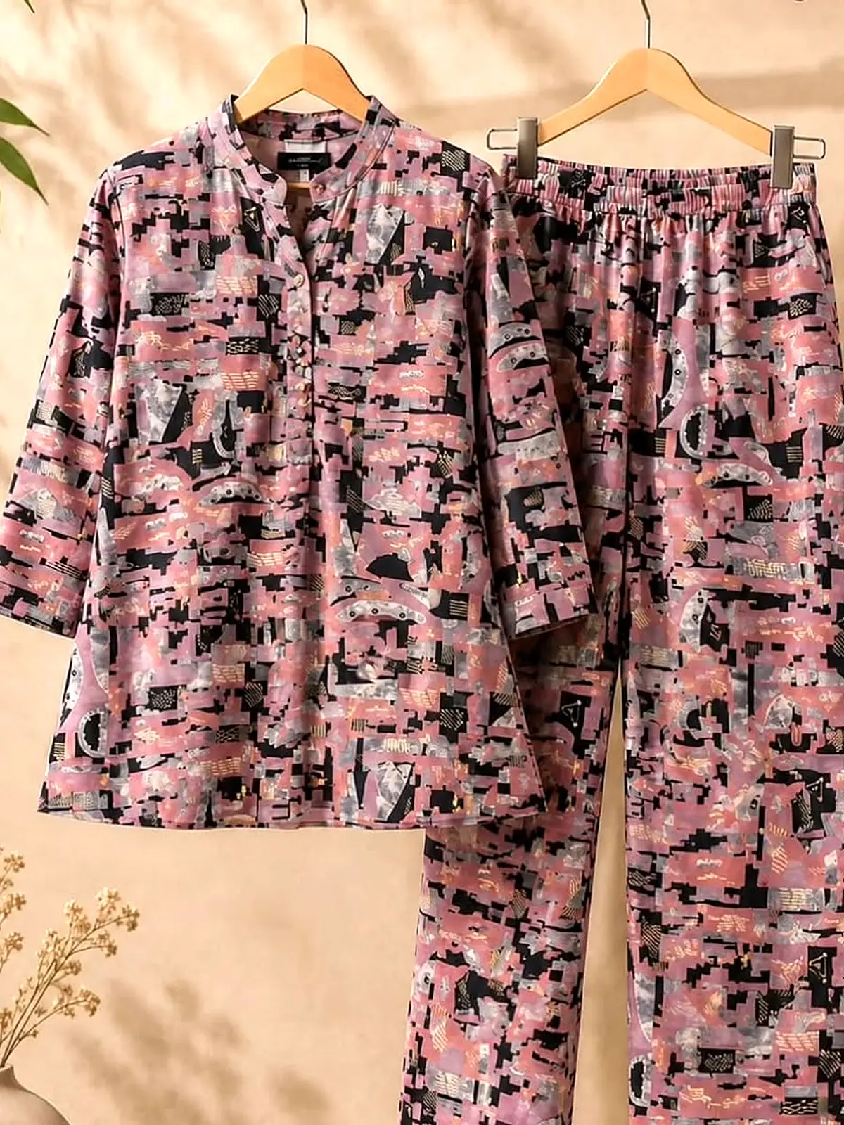 Rose and charcoal abstract print cord set on wooden hangers