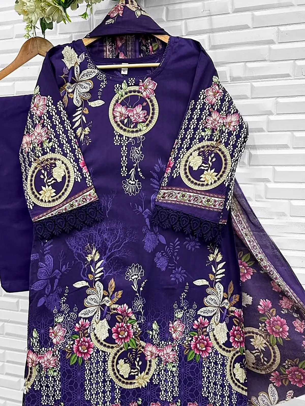 Deep violet floral print kurta with lace cuffs and dupatta on a hanger